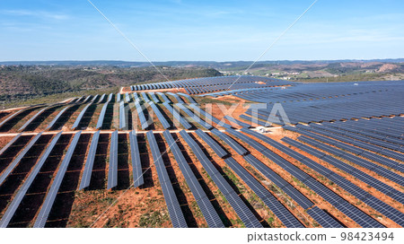 Aerial. Station's solar panels cover the fields of the Portuguese hills to generate clean, ecological electrical energy. 98423494