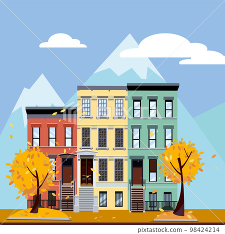 Multicolored multi-party houses at the foot of the mountains. Flat cartoon vector illustration of Autumn city landscape. Three-four-story colorful houses under clouds and blue sky. Street cityscape. Multicolored multi-party houses at the foot of the mountains. Flat cartoon vector illustration of Autumn city landscape. Three-four-story colorful houses under clouds and blue sky. Street cityscape. 98424214