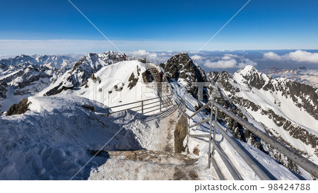 Snowy winter high mountain landscape. Snowy winter high mountain landscape. 98424788