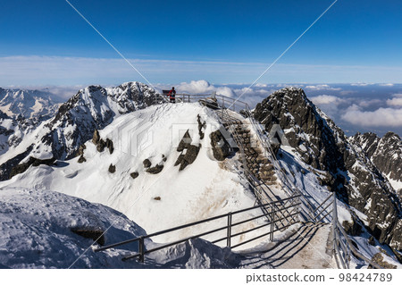 Snowy winter high mountain landscape. Snowy winter high mountain landscape. 98424789