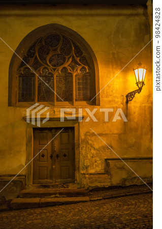 Detail of St. Catherine's church in Banska Stiavnica at night. 98424828