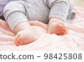 pink cloth and baby feet 98425808