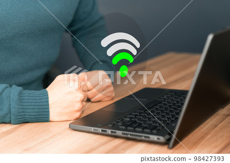 Man using a computer laptop to connect to wifi but wifi signal .is very weak, and waiting to loading digital business data form website, concept technology of waiting for connect to wifi. 98427393