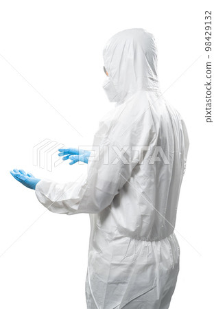 Worker wears medical protective suit or white coverall suit hand extend isolated on white 98429132