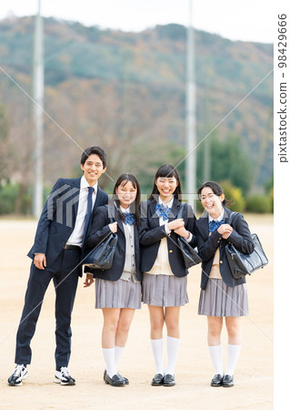 High school girls and boys lined up in the schoolyard 98429666