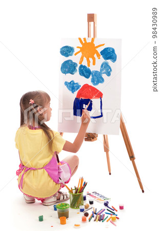 The child is drawing. Children's painting. Little girl draws the sun. The schoolboy does his homework in art. Arts and crafts for children. Paint on children's hands. Creative little artist at The child is drawing. Children's painting. Little girl draws the sun. The schoolboy does his homework in art. Arts and crafts for children. Paint on children's hands. Creative little artist at 98430989