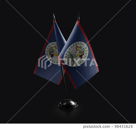 Small national flags of the Belize on a black background 98431628