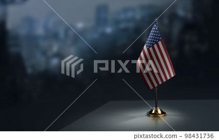 Small flags of the USA on an abstract blurry background 98431736