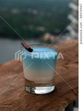 A glass of Blue matcha latte tea or Butterfly pea flower milk tea latte from the dried flowers of the butterfly pea plant (clitoria). 98434447