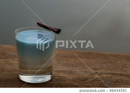 A glass of Blue matcha latte tea or Butterfly pea flower milk tea latte from the dried flowers of the butterfly pea plant (clitoria). 98434591