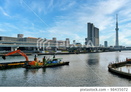 View of Tokyo Skytree from Sumidagawa Terrace and dredging work near Shirahige Bridge View of Tokyo Skytree from Sumidagawa Terrace and dredging work near Shirahige Bridge 98435072