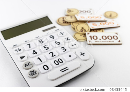Calculator and toy money. financial image Calculator and toy money. financial image 98435445