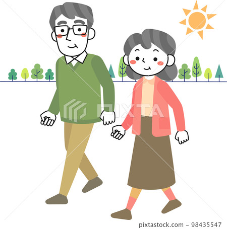 Senior couple walking in the green while soaking up the sunlight 98435547