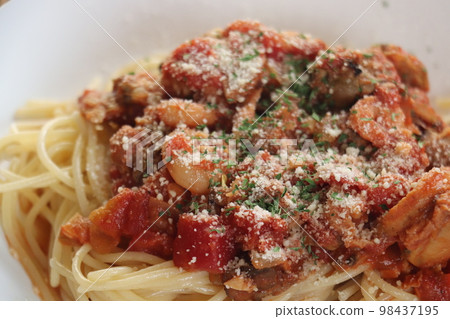 Pescatore up with basil and grated cheese Pescatore up with basil and grated cheese 98437195
