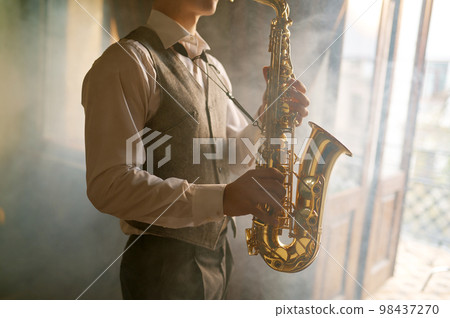Saxophone player foggy toned cropped shot Saxophone player foggy toned cropped shot 98437270