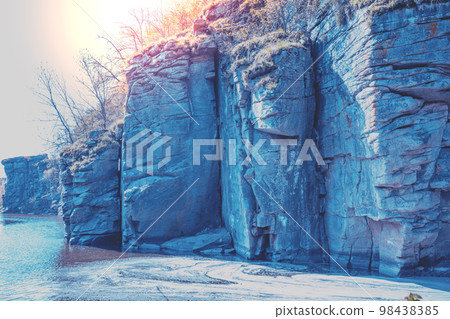 View to a mountain river in early spring. Rocky riverbanks 98438385