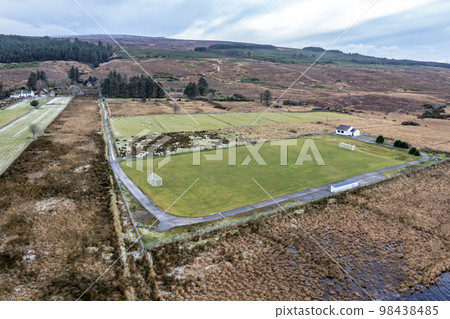 Aerial view of the GAA pitch next to Mount Errigal in Donegal - Ireland. 98438485