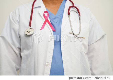 Asian woman doctor with pink ribbon, World Breast Cancer Day at October. Asian woman doctor with pink ribbon, World Breast Cancer Day at October. 98439160