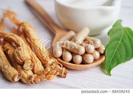 Ginseng roots and green leaf, healthy food. Ginseng roots and green leaf, healthy food. 98439243