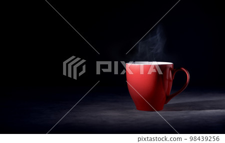 Hot Red Coffee Cup on Table with Stream. Dark Tone, Side View with more Copy Space 98439256