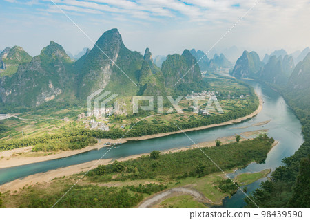 Karst hills by Li River near Xingping. Karst hills by Li River near Xingping. 98439590