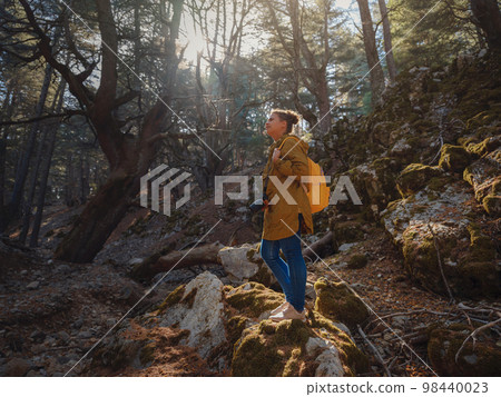 caucasian woman enjoys being in nature, caucasian woman enjoys being in nature, 98440023