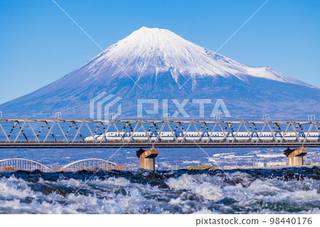 (Shizuoka Prefecture) Shinkansen crossing the Fuji River, one of Japan's three most rapid streams, with Mt. Fuji in the background (Shizuoka Prefecture) Shinkansen crossing the Fuji River, one of Japan's three most rapid streams, with Mt. Fuji in the background 98440176