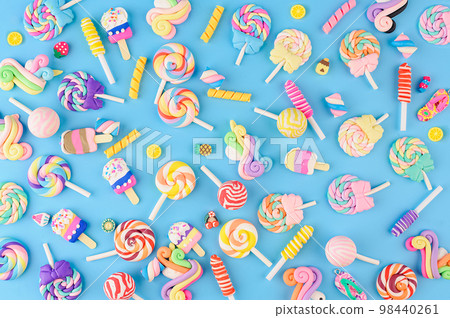 Background solid of decorative sweets, lollipops and ice cream. 98440261