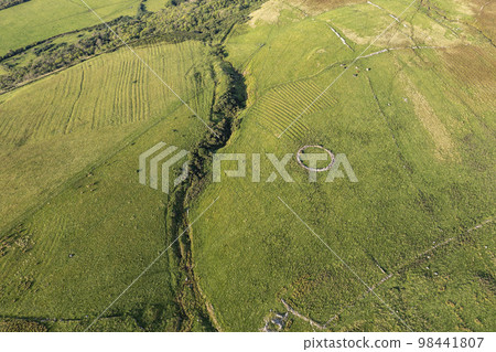 Aerial views of ruins and round sheepfolds at Gortmore in Northern Ireland 98441807