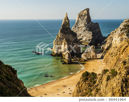 Stunning view of Praia da Ursa (bear beach) and its huge rocky formations Ursa and Gigante stones, Cabo da Roca cape, Portugal 98441964