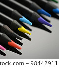Colored pencils for drawing on a black background 98442911