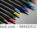 Colored pencils for drawing on a black background 98442912
