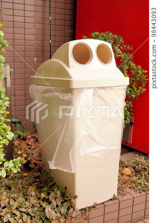 Garbage bin next to the vending machine Garbage bin next to the vending machine 98443093