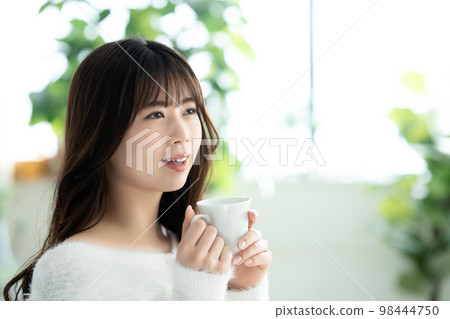 knitted woman drinking coffee knitted woman drinking coffee 98444750