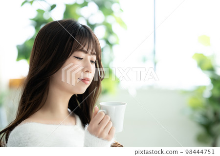 knitted woman drinking coffee knitted woman drinking coffee 98444751
