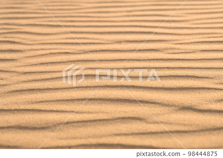 Sand background with dunes. Sand desert texture. low angle view. Sand background with dunes. Sand desert texture. low angle view. 98444875