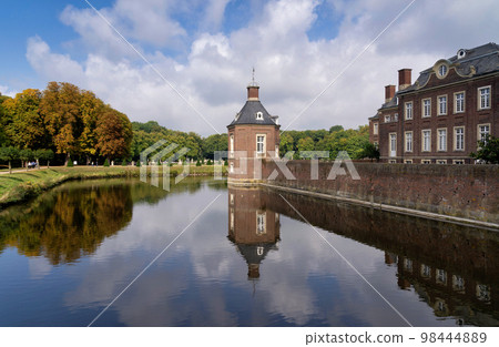 Tower from Nordkirchen Castle in Germany reflecting in the moat Tower from Nordkirchen Castle in Germany reflecting in the moat 98444889