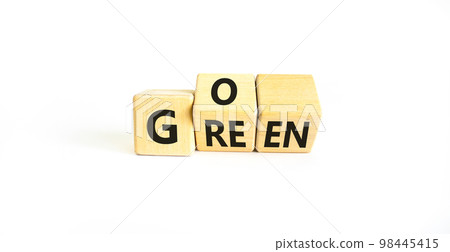 Ecology and go green symbol. Concept words Go green on wooden cubes. Beautiful white table white background. Business ecological and go green concept. Copy space. 98445415