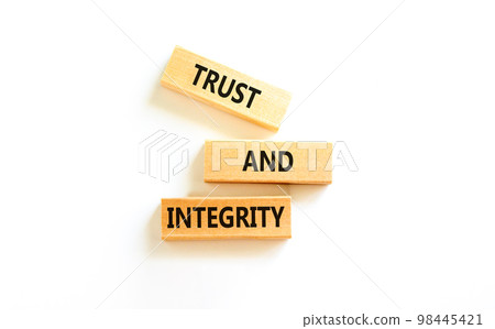 Trust and integrity symbol. Concept words Trust and integrity on wooden blocks. Beautiful white table white background. Business, psychological and trust and integrity concept. Copy space. 98445421
