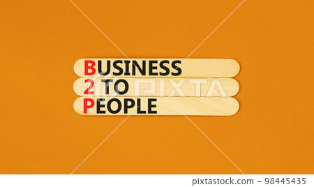 B2H business to people symbol. Concept words B2H business to people on wooden sticks on a beautiful orange table orange background. Business and B2H business to people concept. Copy space. B2H business to people symbol. Concept words B2H business to people on wooden sticks on a beautiful orange table orange background. Business and B2H business to people concept. Copy space. 98445435