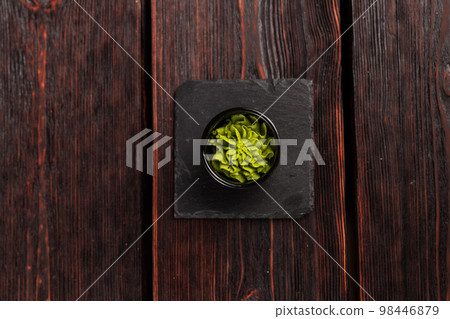 Green wasabi sauce or paste in bowl on wooden background top view 98446879