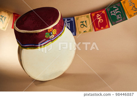 Happy Sonam Losar lunar New Year festival of Nepal. Traditional Tamang topi hat, hand drum and flags Om mani padme hum. 98446887