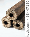 Three wooden pressed briquettes Pini Kay from biomass 98447150