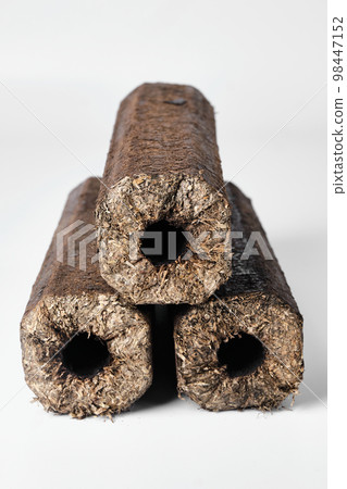 Three wooden pressed briquettes Pini Kay from biomass 98447152
