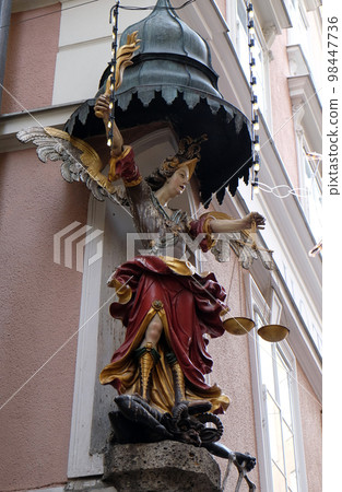 Saint Michael street statue in Salzburg, Austria Saint Michael street statue in Salzburg, Austria 98447736