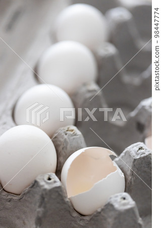 Carton of White Chicken Eggs and Egg Shells. 98447774