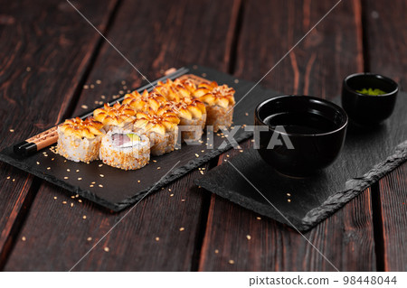 Sushi roll with smoked tuna with avocado and cheese. Traditional delicious fresh sushi roll set. Sushi menu. Japanese cuisine restaurant. Asian food 98448044