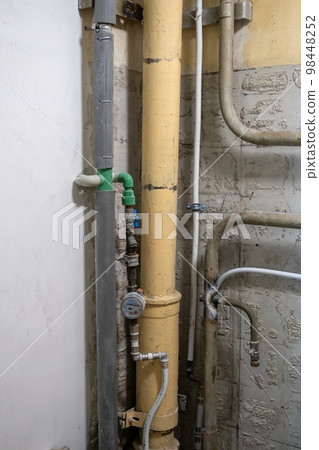 Plumbing system in old premises. Water drainage circuit, Plumbing problems, Works related to leaking faucet, Dark tone, Selective focus. 98448252