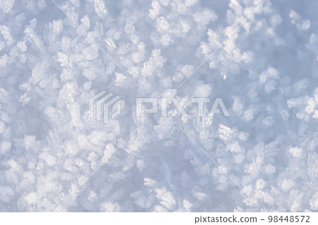 Spring grainy blue snow background, snow as background, closeup view. Winter weather 98448572