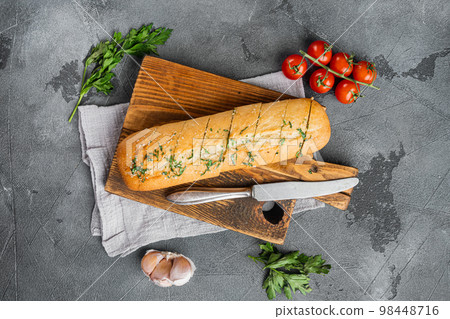 Homemade vegetarian sandwich cream cheese butter garlic bread, on gray stone table background, top view flat lay 98448716